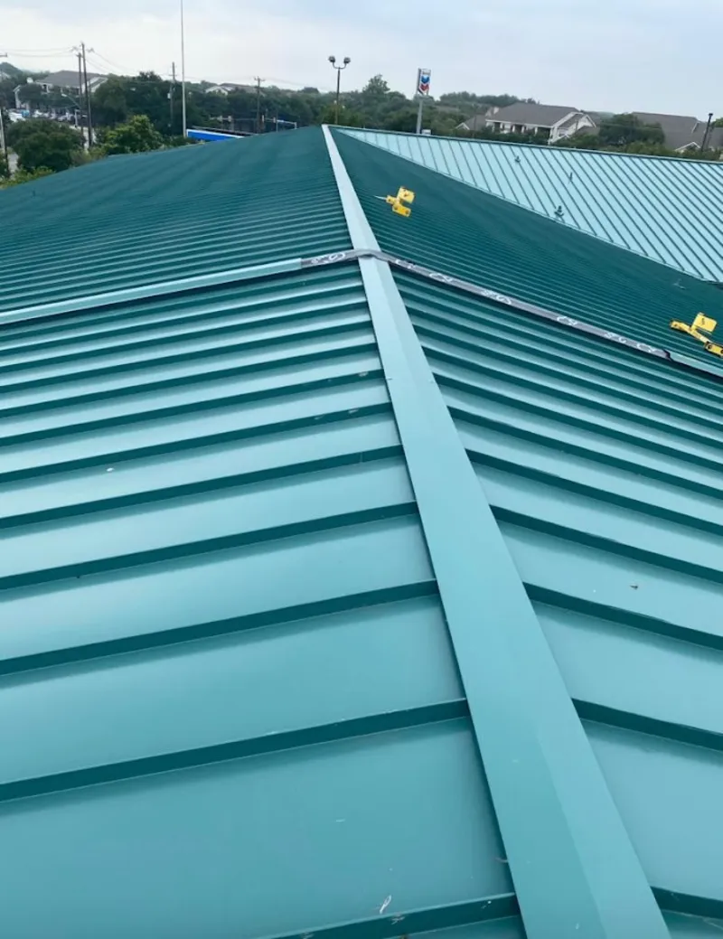 Green commercial metal roof ridge and valley for Metal Roof Repair in Covington