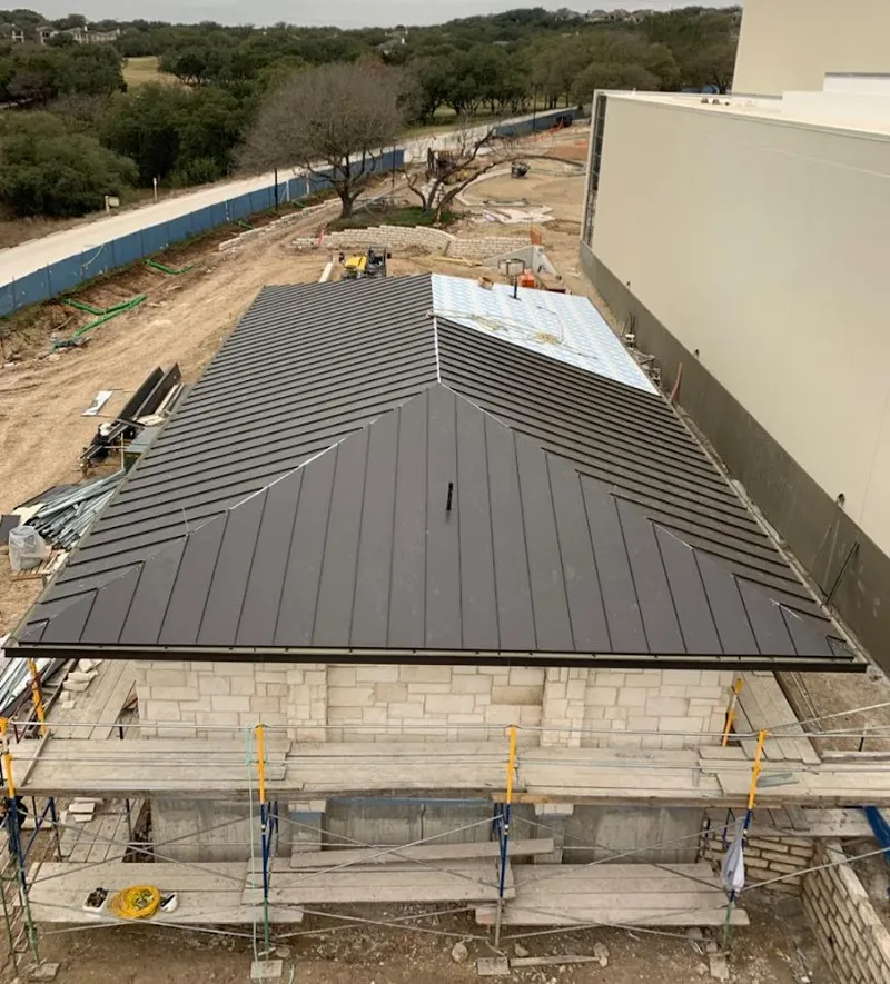 Metal roof new construction with scaffolding in Covington